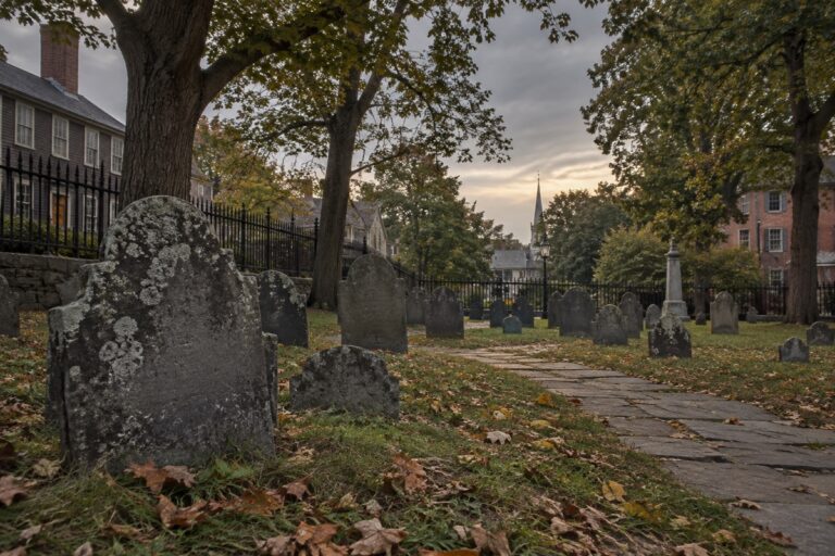 AI-created editorial interpretation of Howard Street Cemetery in Salem under an overcast sky
